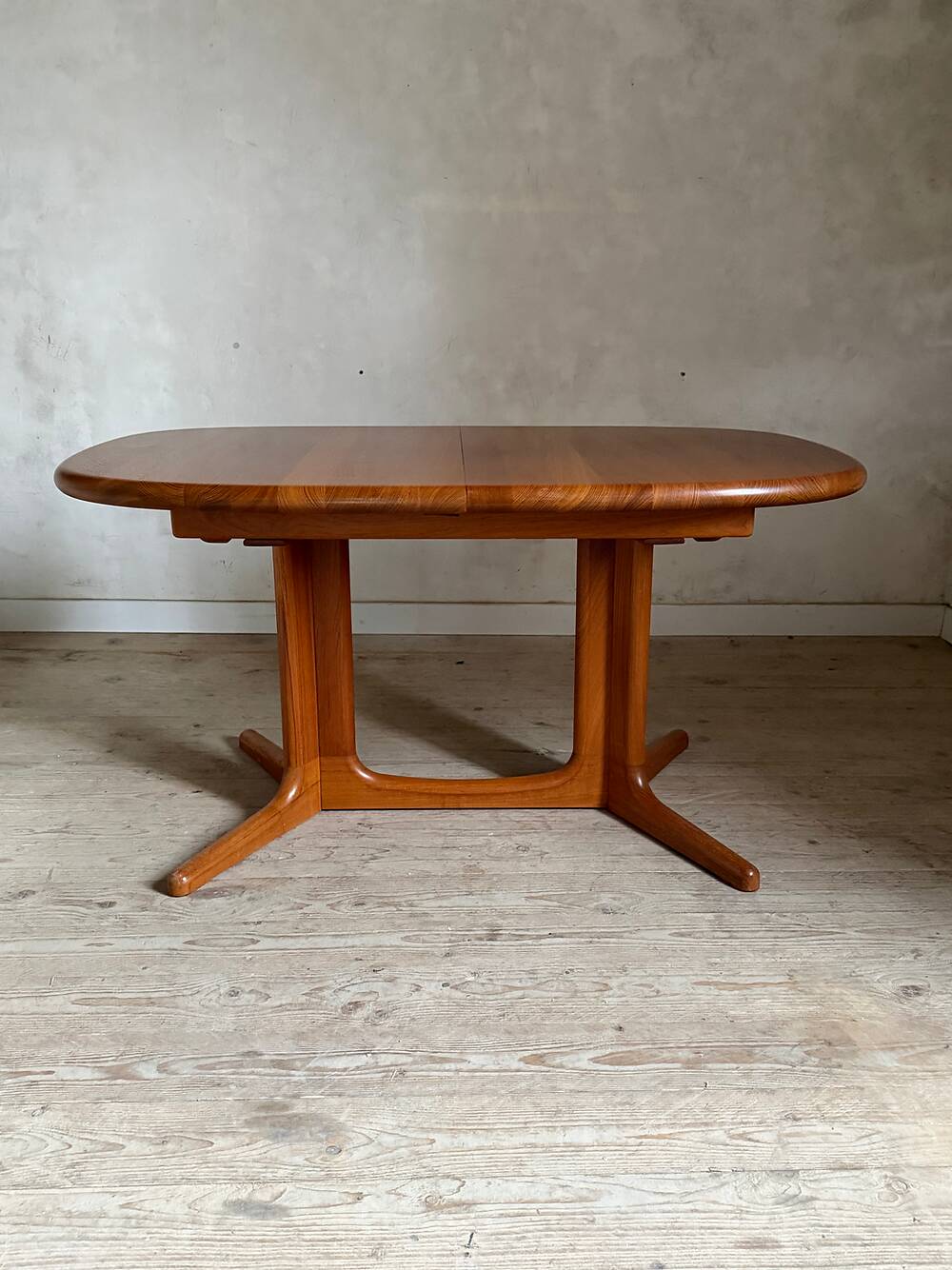 Vintage oval teak Scandinavian table with a central star base from Glostrup.