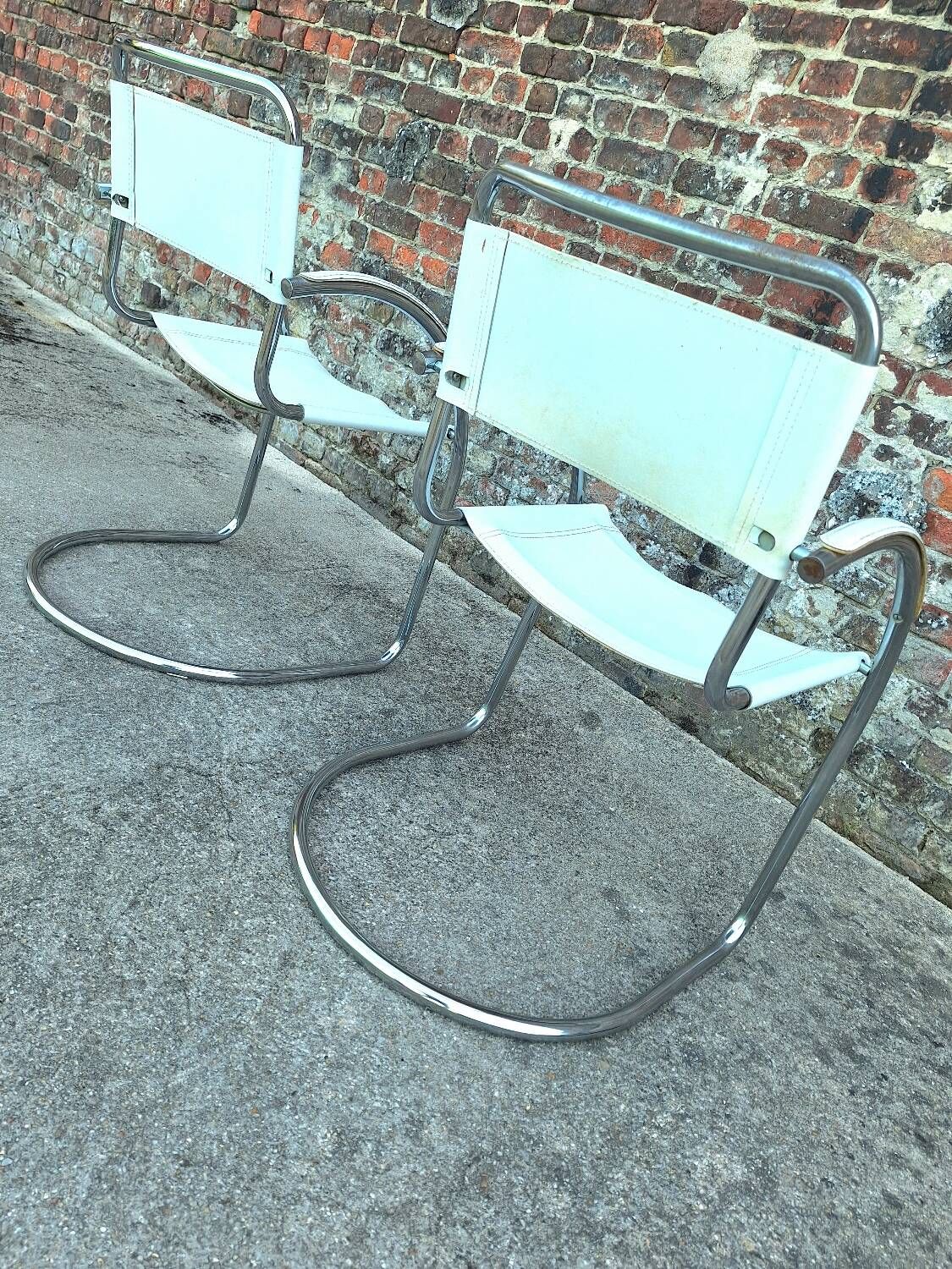 Pair of vintage tubular armchairs, designer seating furniture