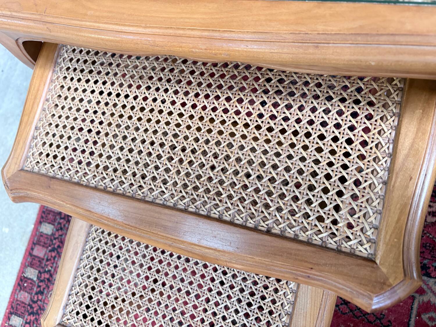 Vintage nesting tables in wood and cane – perfect condition.