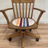 Solid wood swivel and reclining armchair.