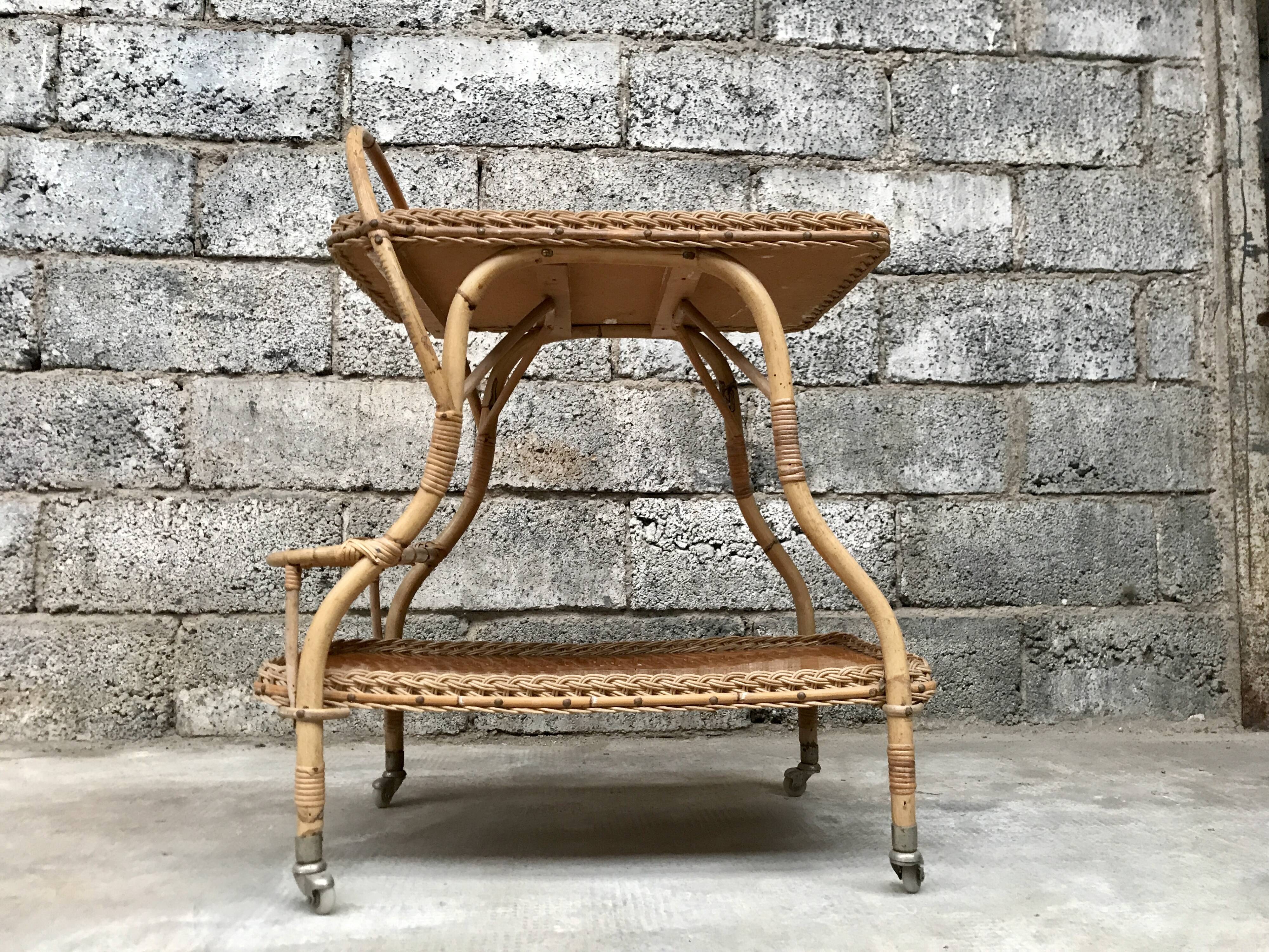 Rolling dessert in woven wicker bamboo rattan with 1950 bottle holder