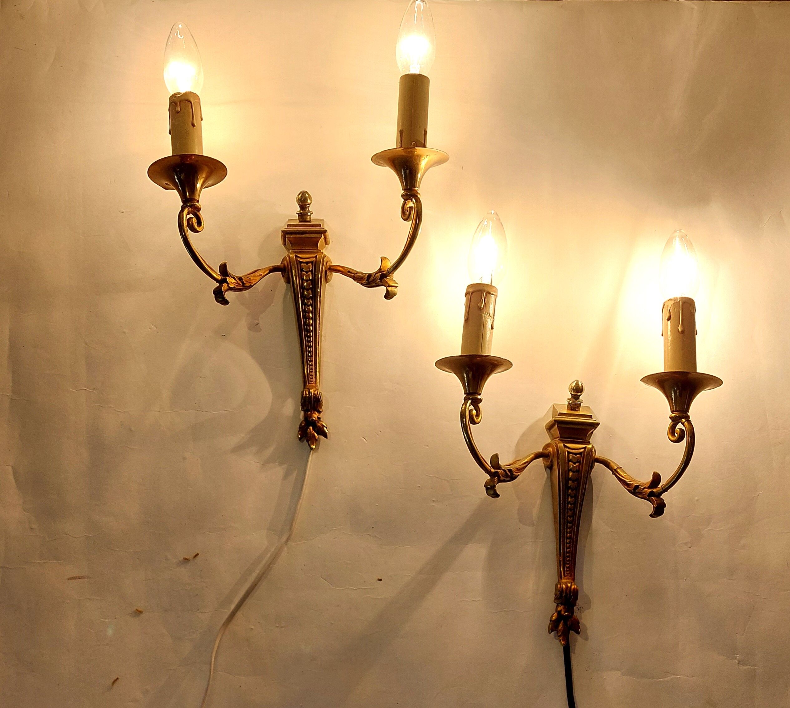 Pair of neoclassical sconces in bronze and gilded brass 1950.