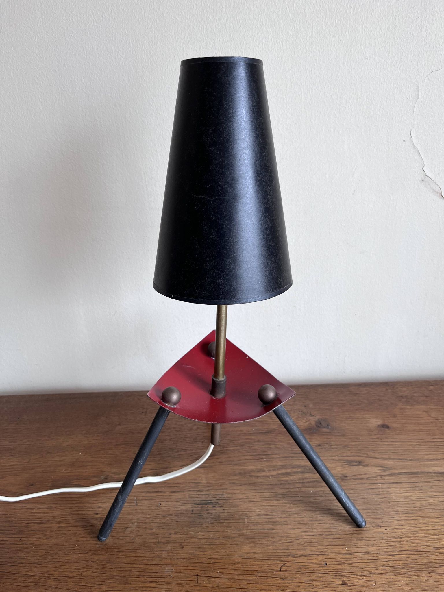 1950s modernist tripod lamp made of sheet metal and brass.