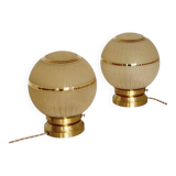 Pair of large art deco globe table lamps with brass legs