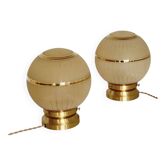 Pair of large art deco globe table lamps with brass legs