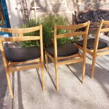 3 Scandinavian-style chairs, light wood and black faux leather