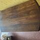 Vintage antique oak table with ornate legs.