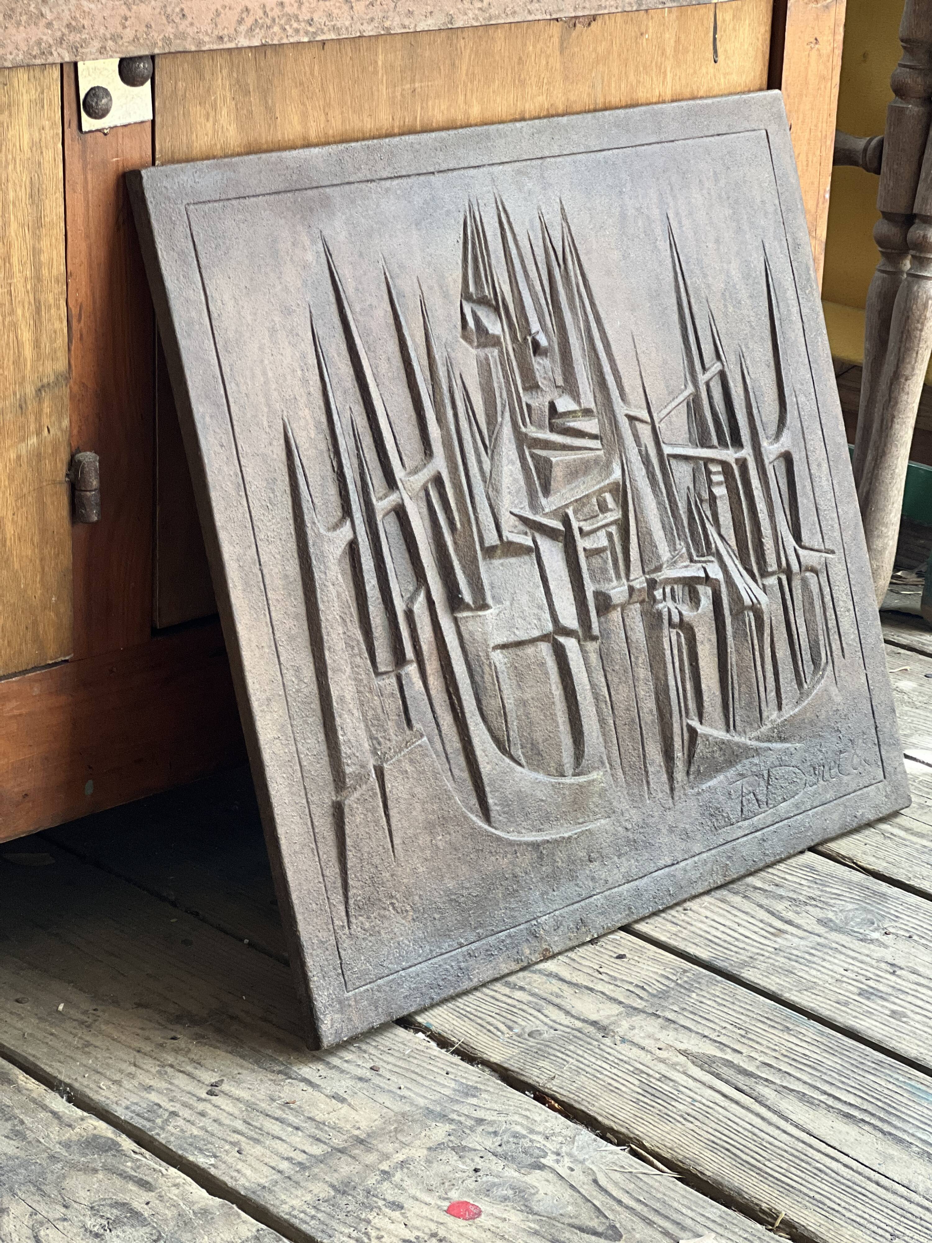 Cast iron plaque signed