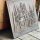 Cast iron plaque signed