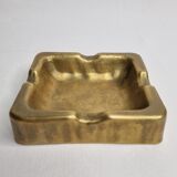 Empty pocket brutalist-inspired ashtray in gilded bronze