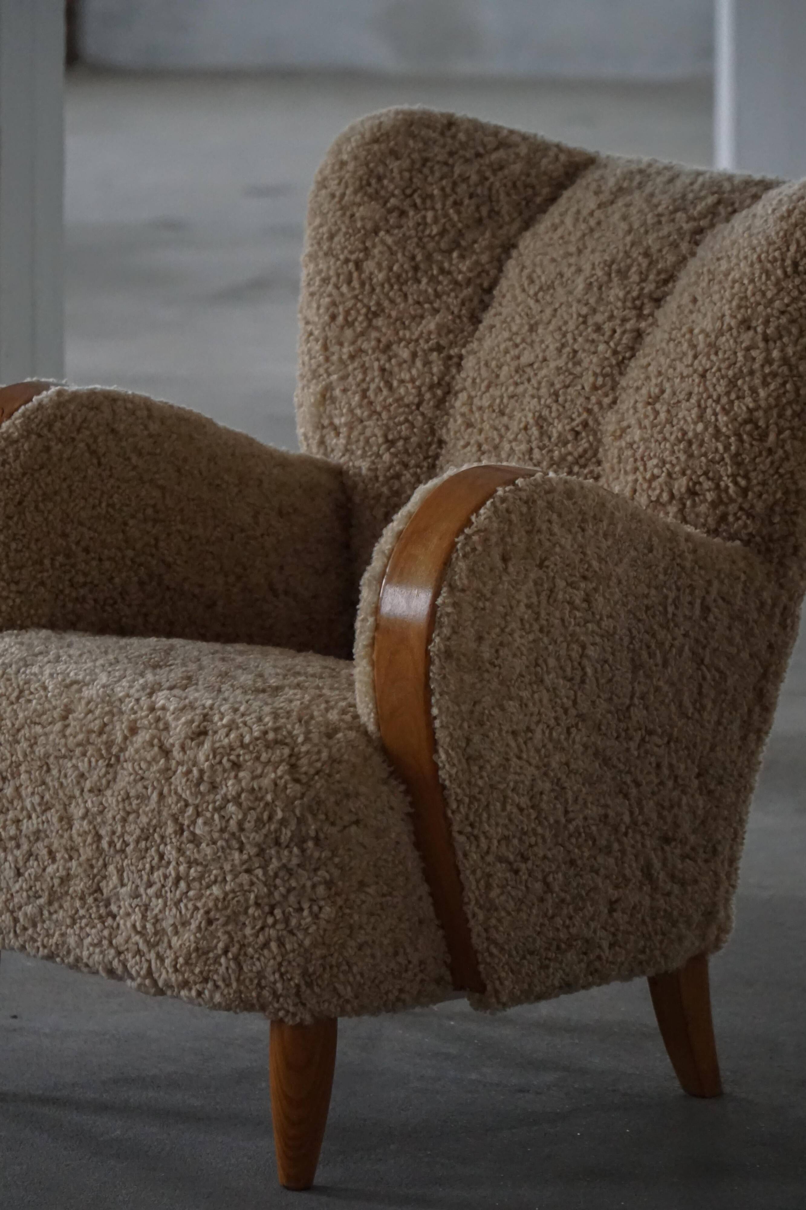 Pair of Danish Art Deco modern lounge chairs in sheepskin with lambswool and elm, 1940s.