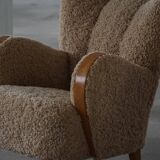 Pair of Danish Art Deco modern lounge chairs in sheepskin with lambswool and elm, 1940s.