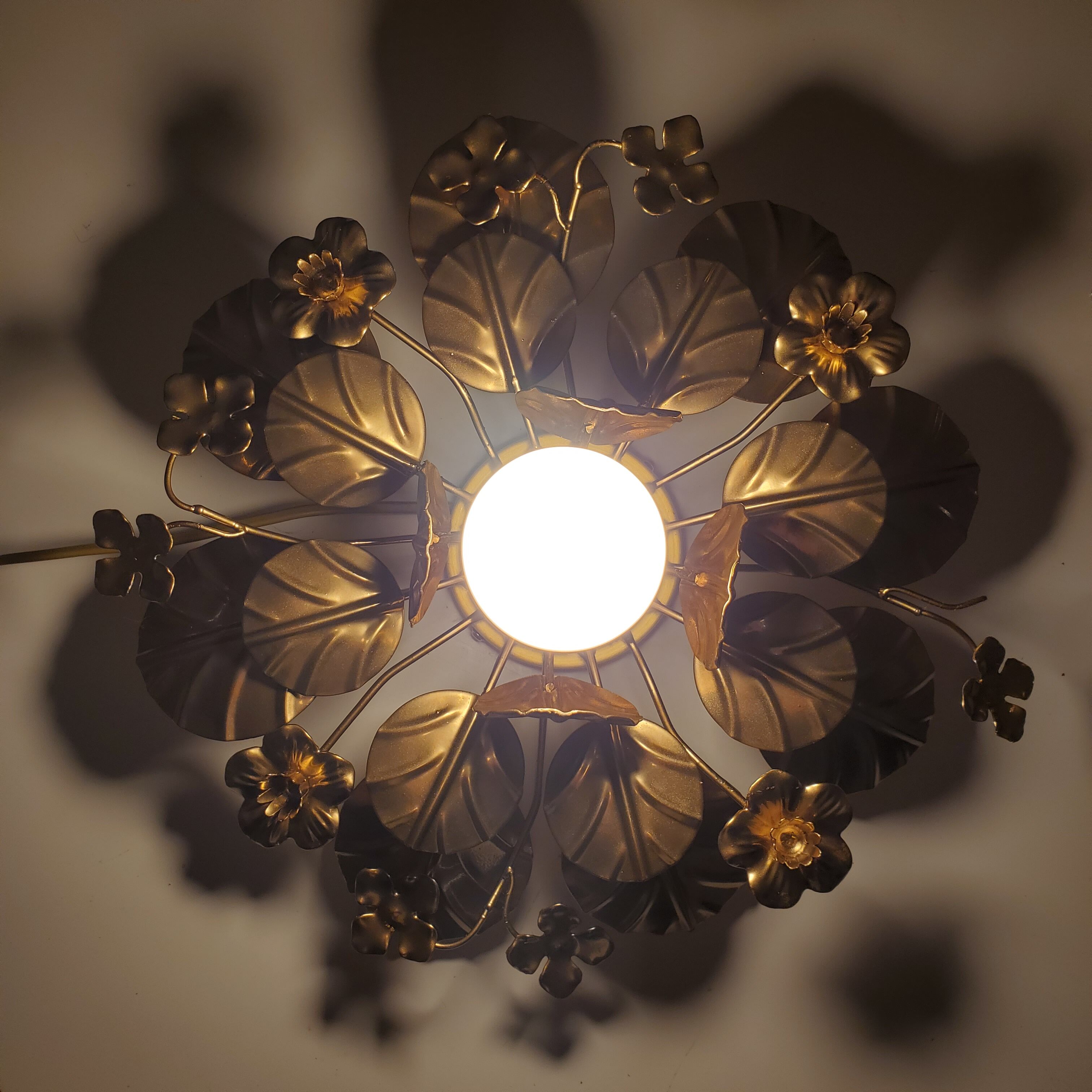 Golden metal flower sconces