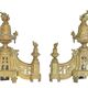 Pair of gilded brass fire dogs decorated with fire pots in the Louis XVI style.