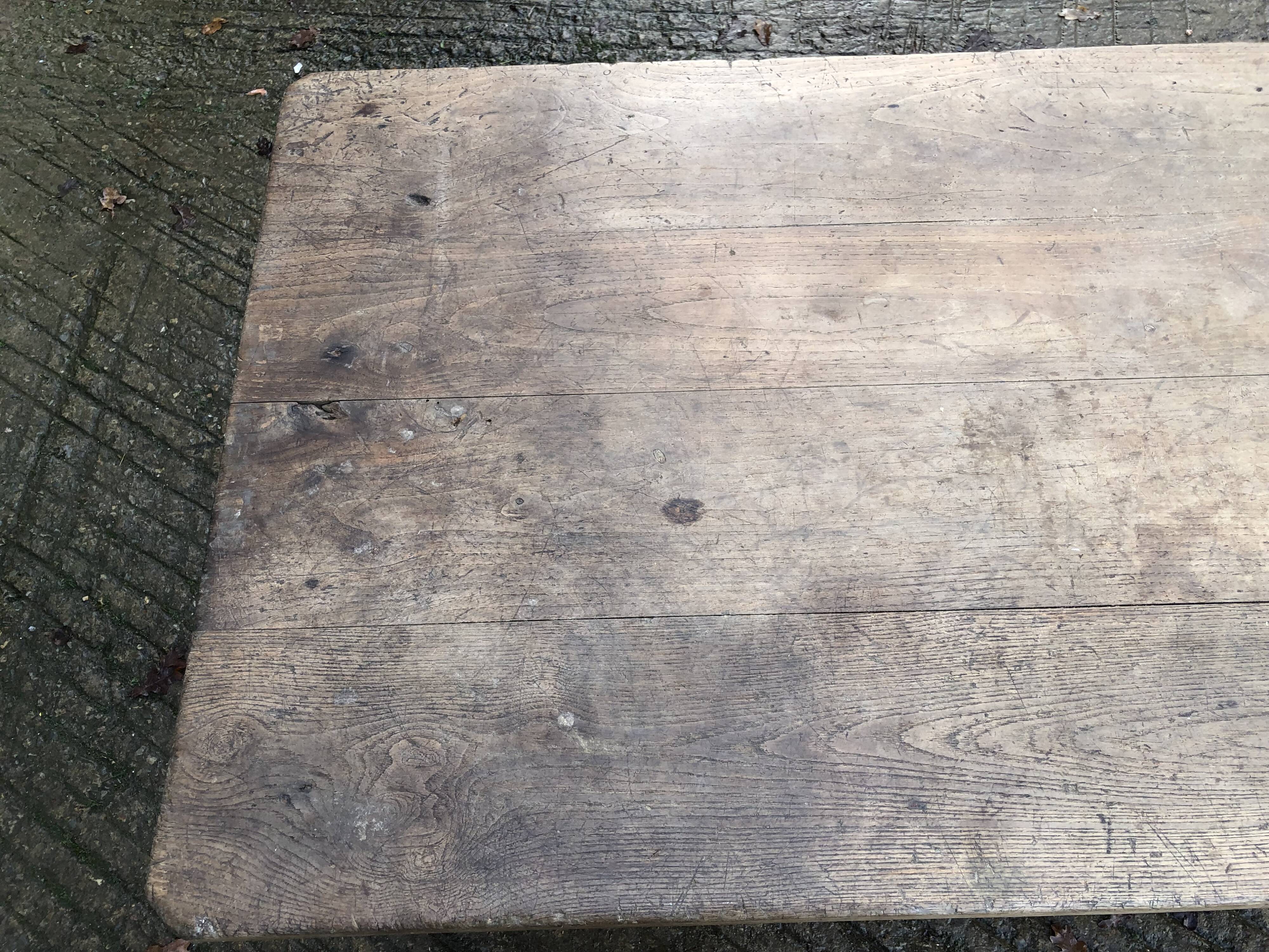 Antique farmhouse table in solid oak with tapered legs and 1 drawer at the end.
