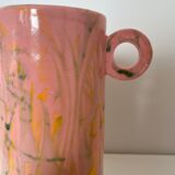 Pink ceramic vase with abstract circular handles