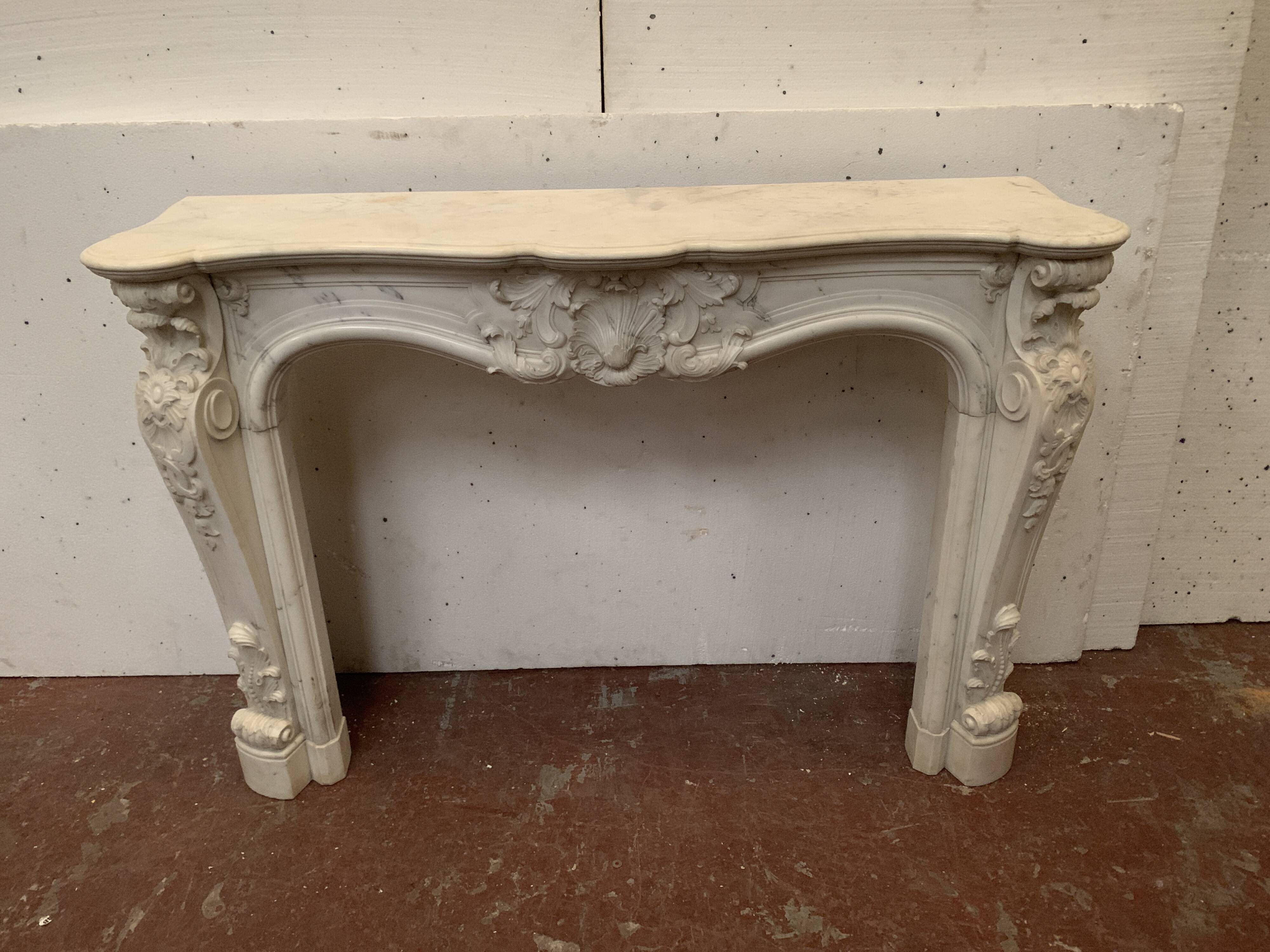 Louis XV style fireplace in white Carrara marble, 19th century