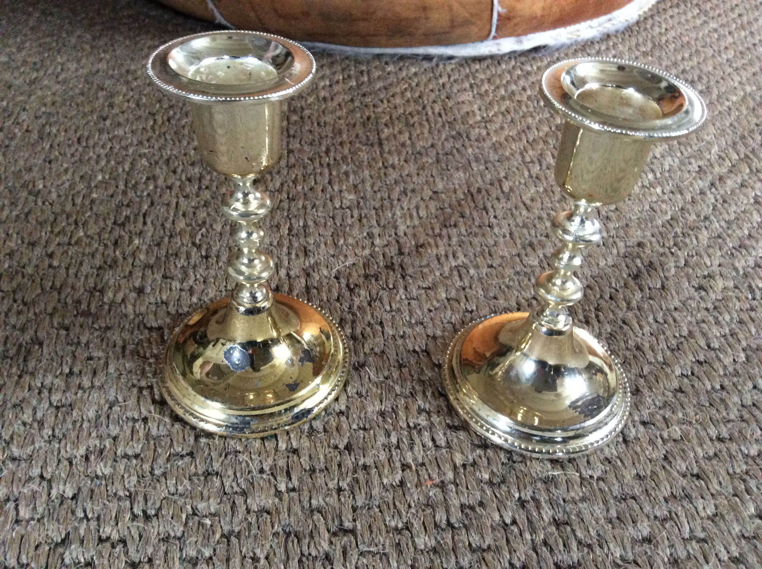 Pair of gold metal candle holders