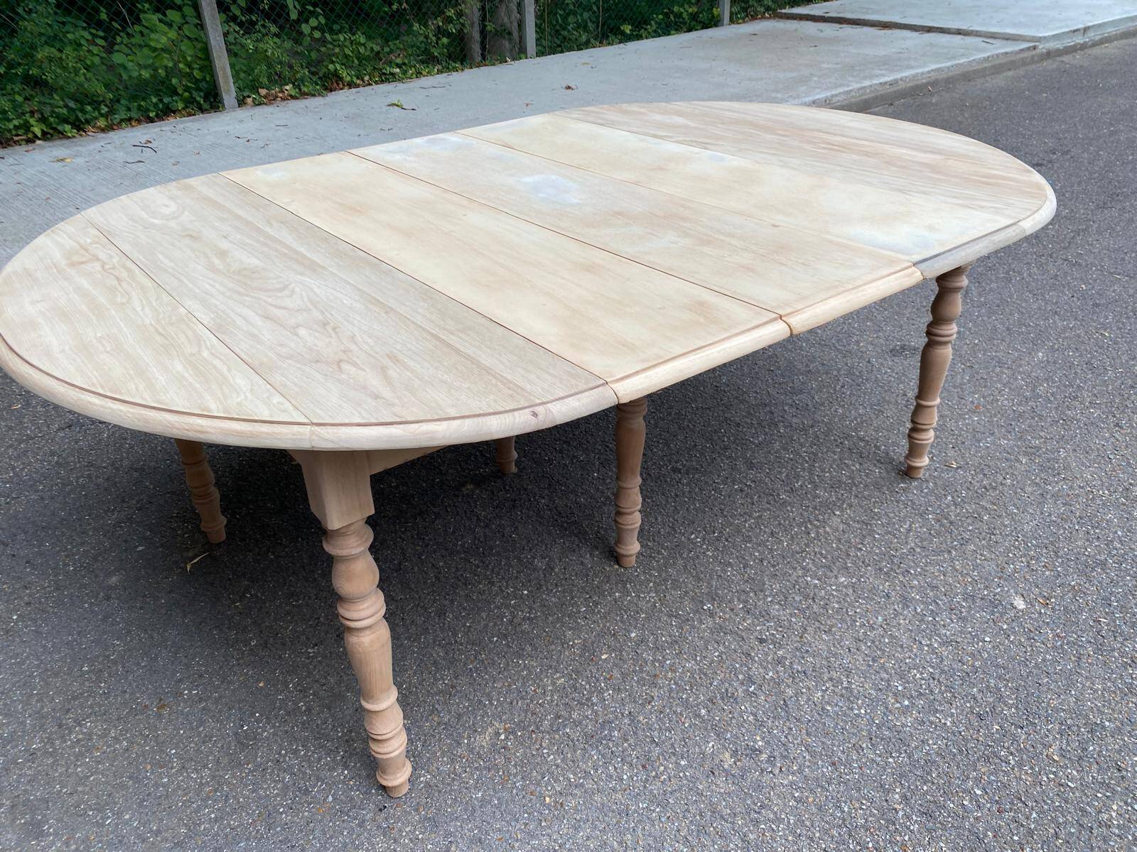 Renovated Louis Philippe round extendable dining table with flaps and 3 extensions.