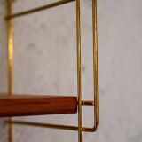 Wall-mounted shelf (Hylla) with brass structure