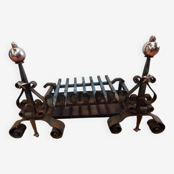 Pair of wrought iron and copper andirons with grille