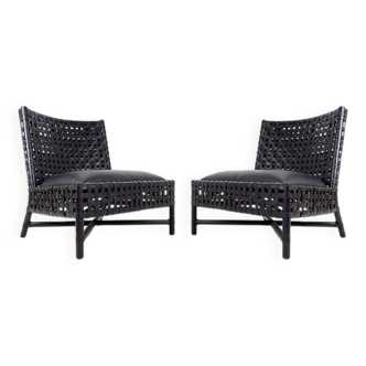 Pair of black woven leather lounge chairs