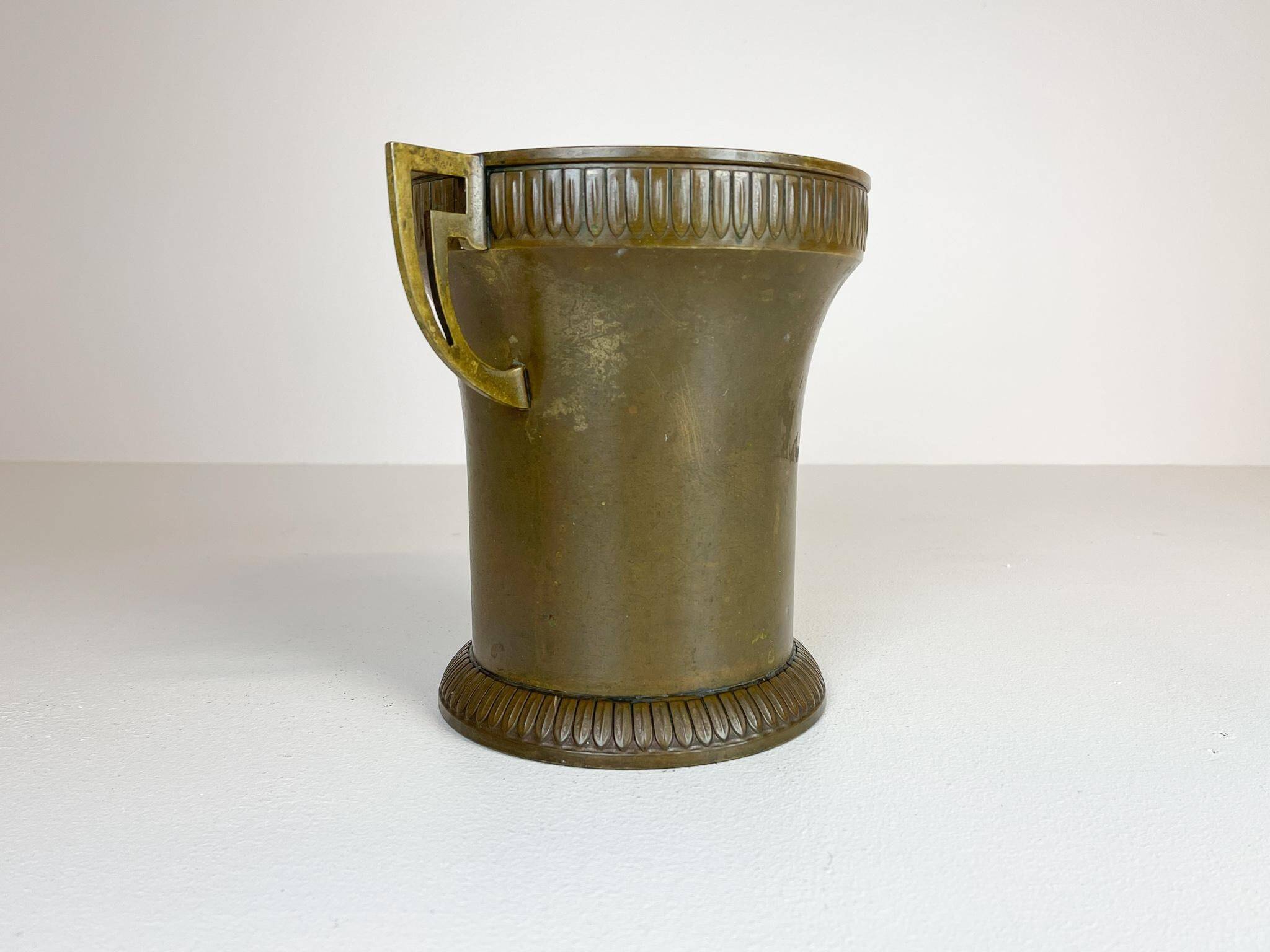 Art Deco champagne cooler in copper and brass with relief patterns, Sweden, 1930s.