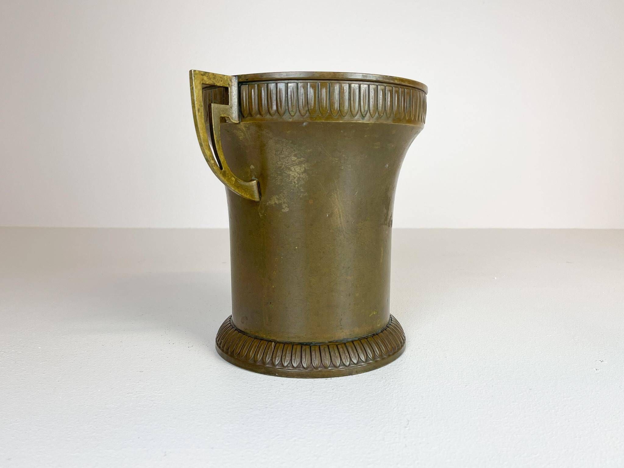 Art Deco champagne cooler in copper and brass with relief patterns, Sweden, 1930s.