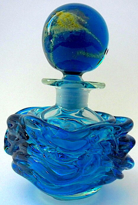 Blown blue glass bottle with inclusions