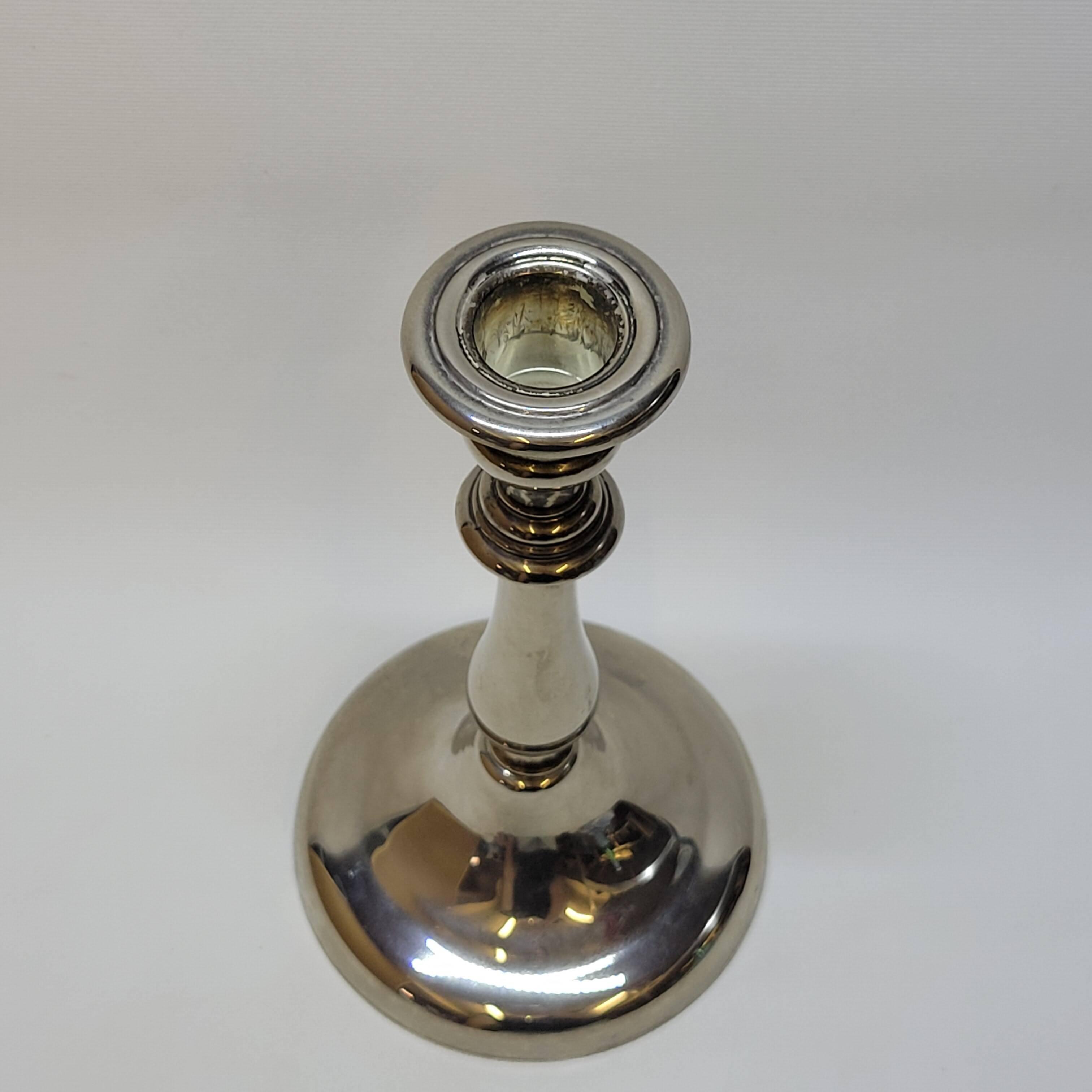 Old candle holder in silver metal