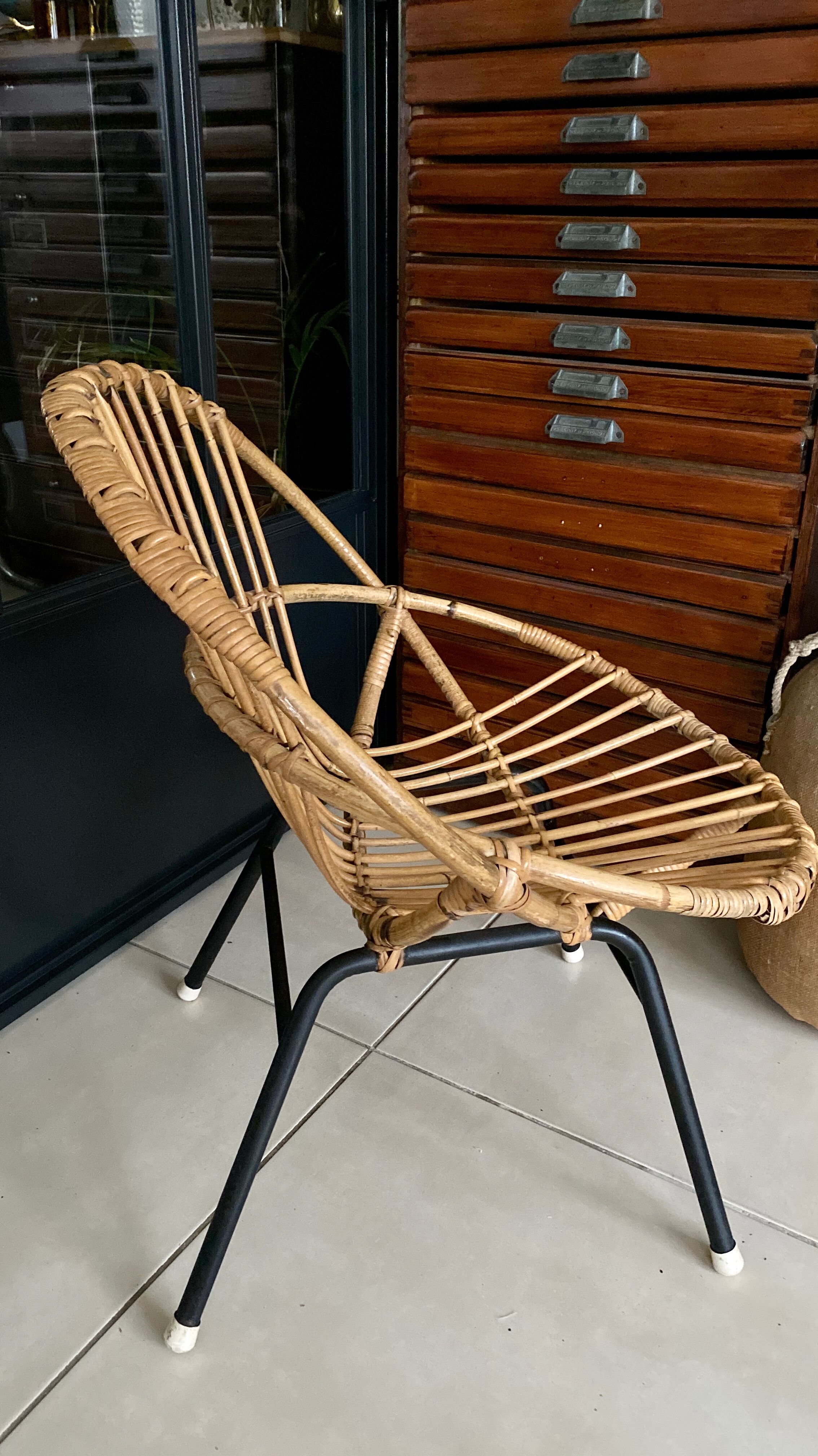 Old vintage metal foot rattan chair