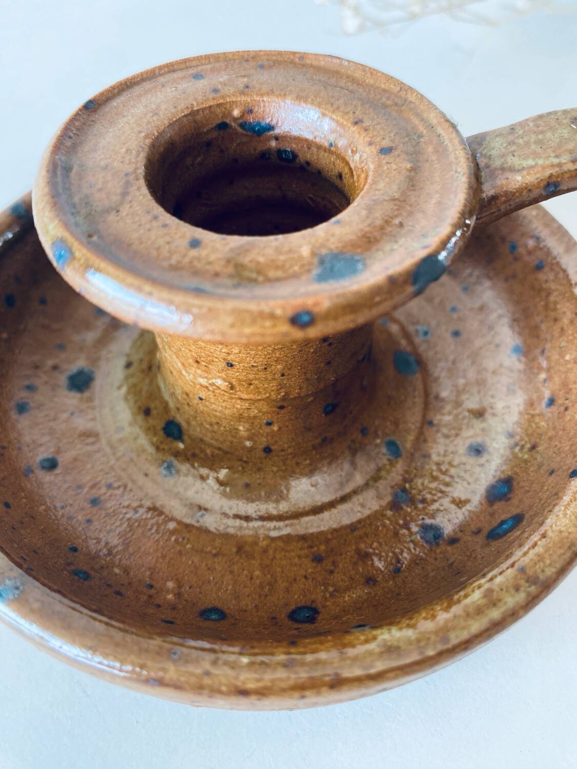 Signed sandstone candle holder