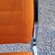 Pair of designer armchairs in orange fabrics and chrome tubes from the 70s