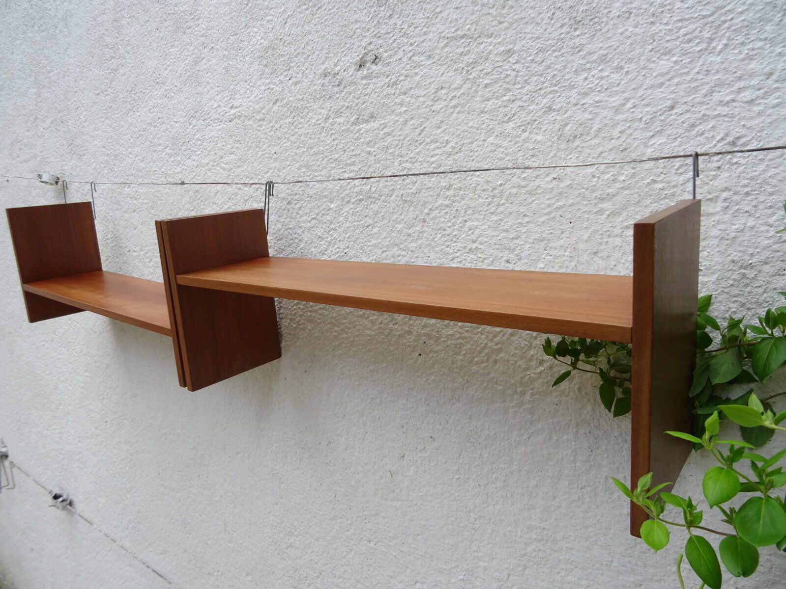 Pair of teak wall shelves