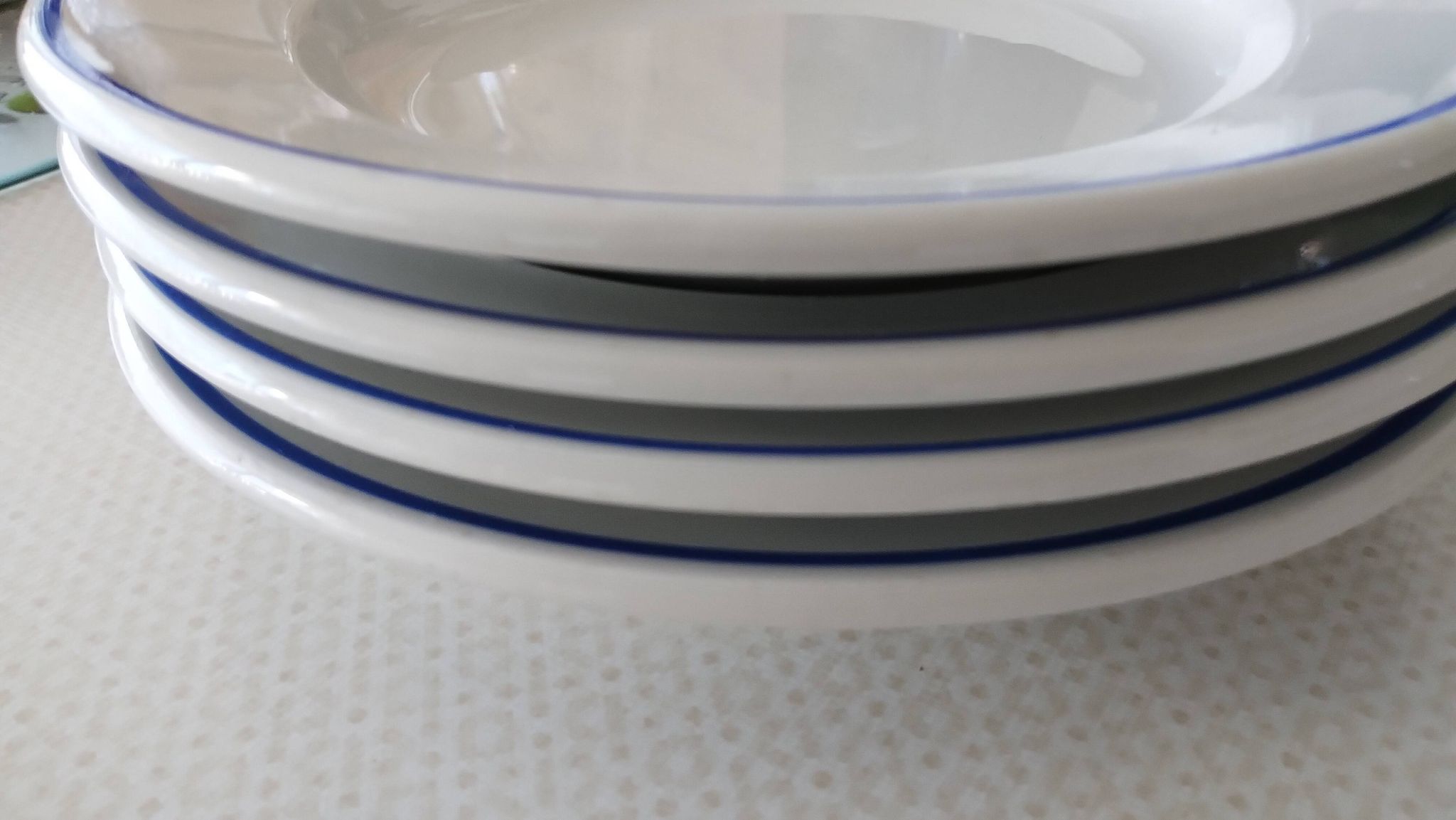 3 Pillivuyt white porcelain dinner plates with blue edging.