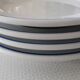 3 Pillivuyt white porcelain dinner plates with blue edging.