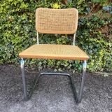 Wooden chair with caning in the style of Marcel Breuer.
