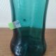 Blown glass vase with a flared neck and wavy rim.