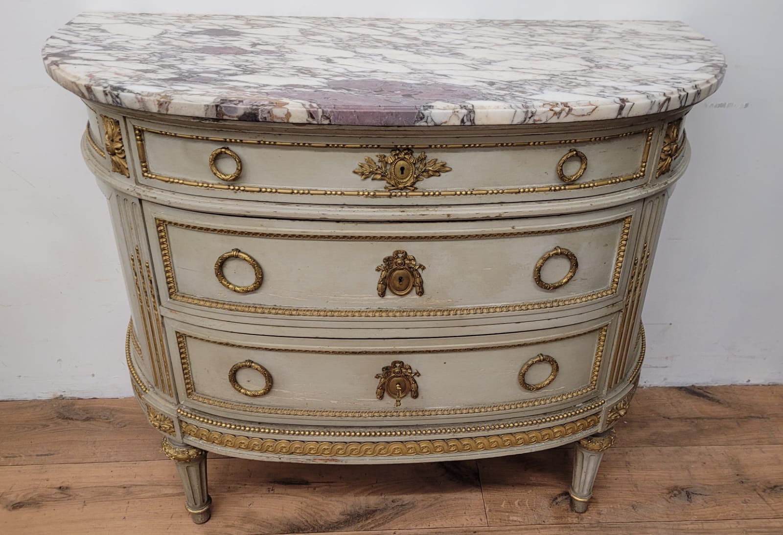 Lacquered half-moon chest of drawers with marble top