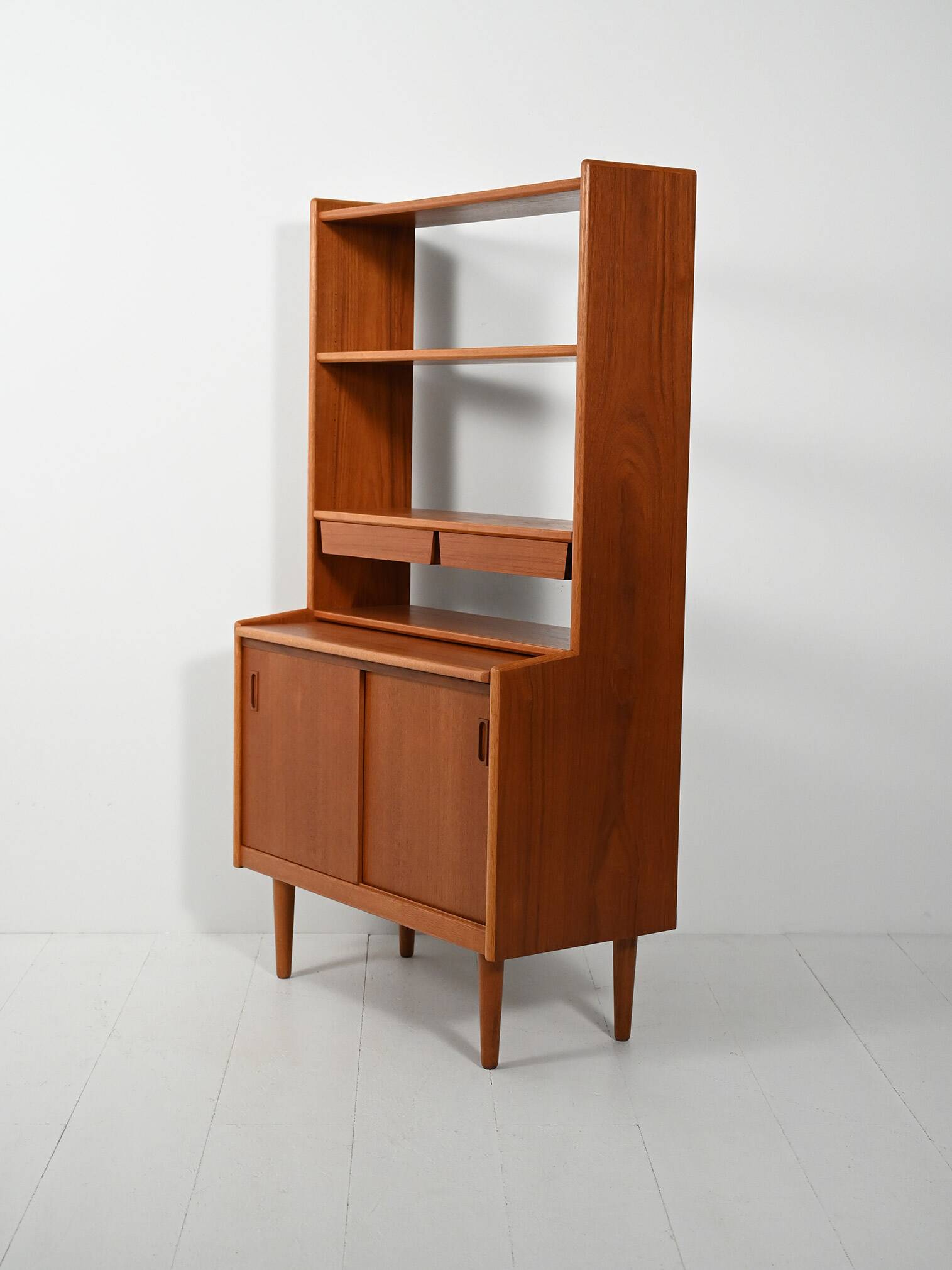 Scandinavian teak bookcase with suspended drawers