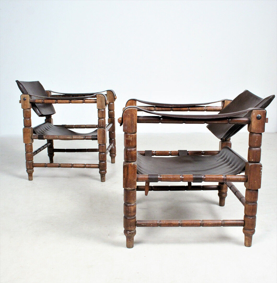 Pairs of vintage Safari style armchairs in wood and leather