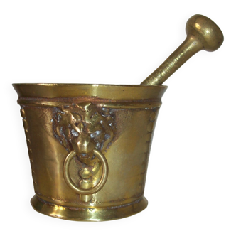 Old mortar and its nineteenth century hapothicarian pestle in bronze