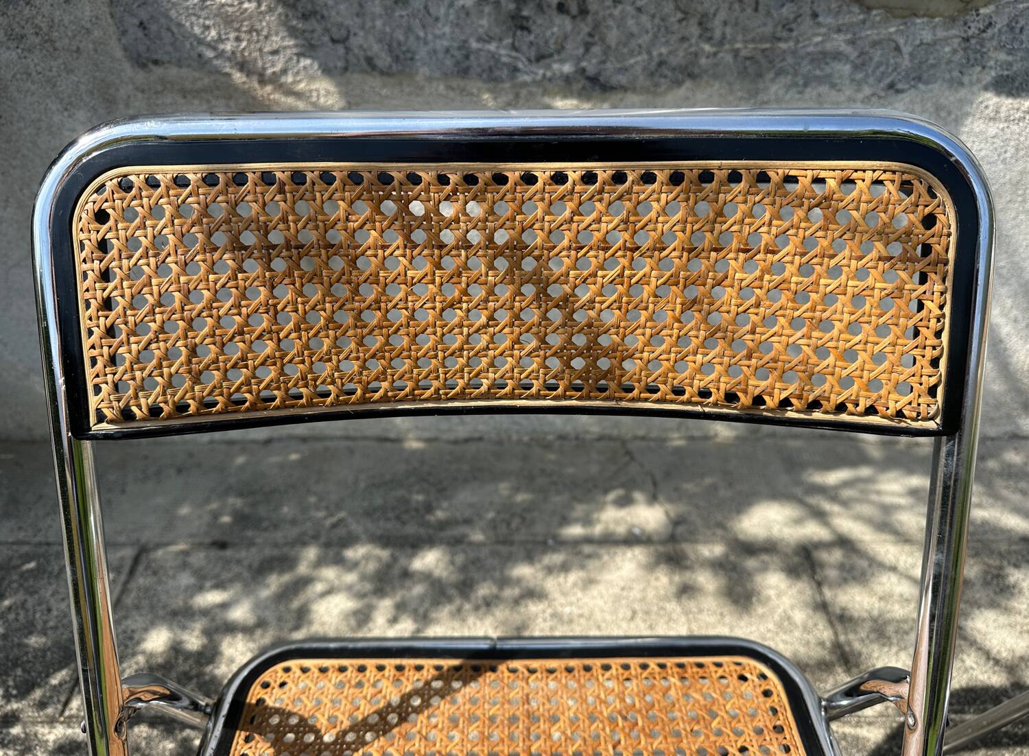 Pair of vintage metal caned folding chairs