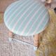 Antique tripod stool with striped seat