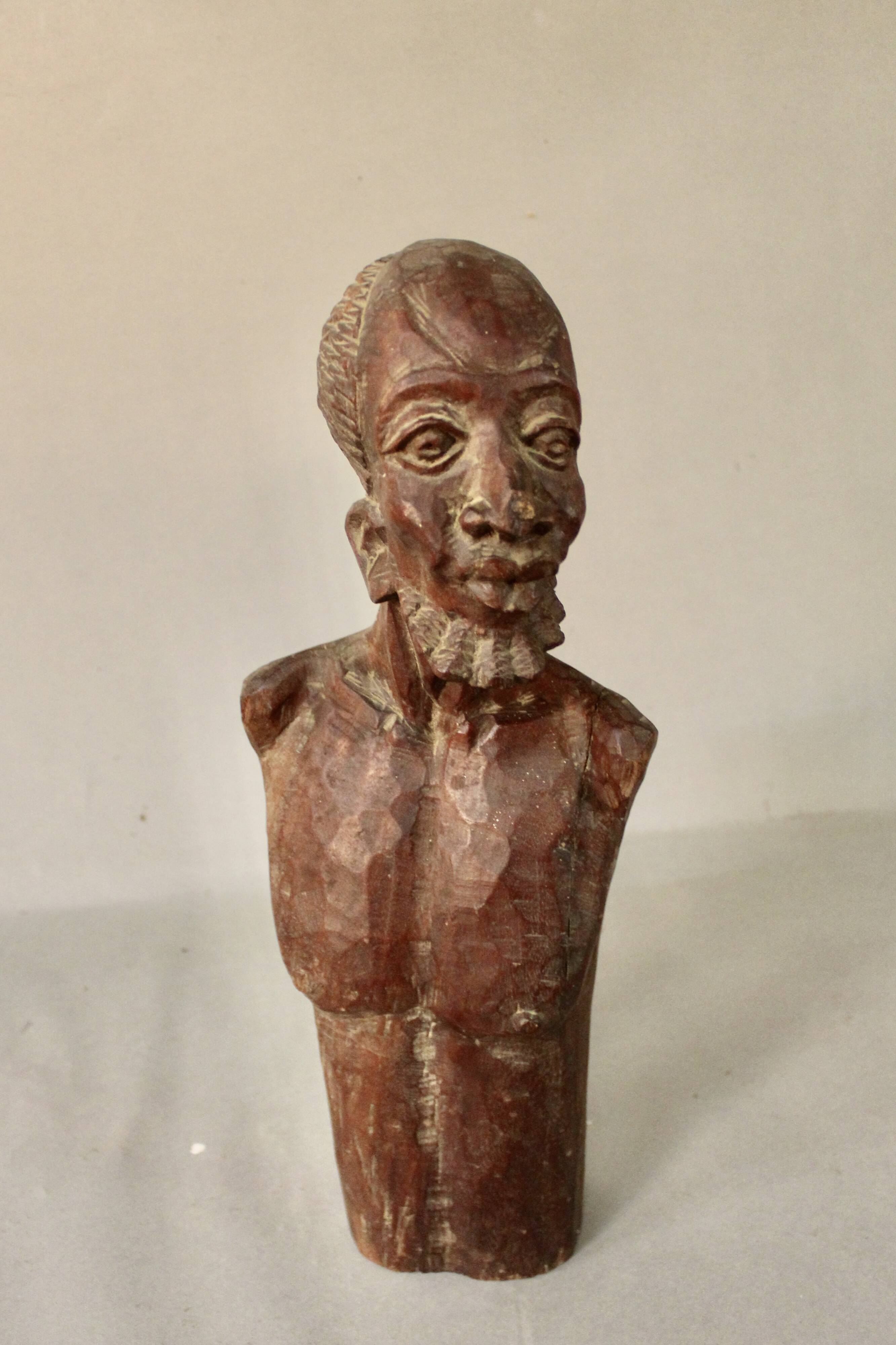 Bust Man in carved wood.