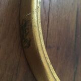 Round frames in gilded wood.