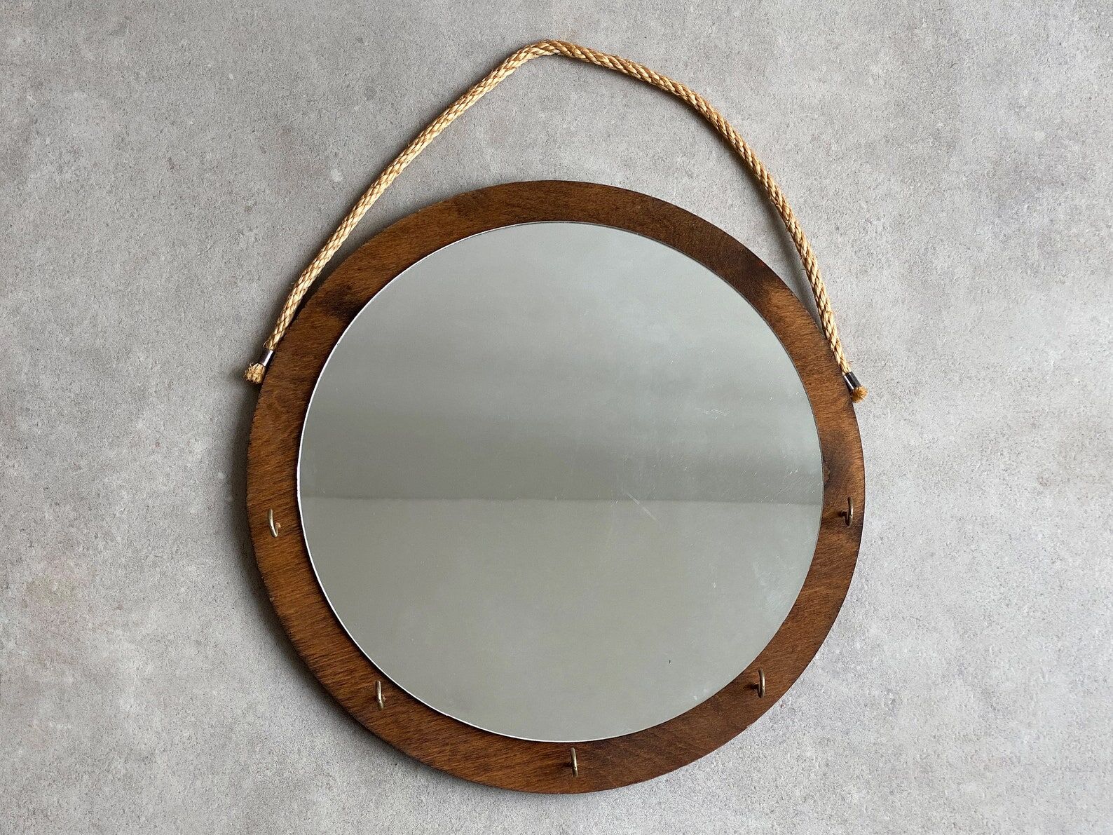 Vintage round wooden wall mirror with hooks