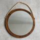 Vintage round wooden wall mirror with hooks