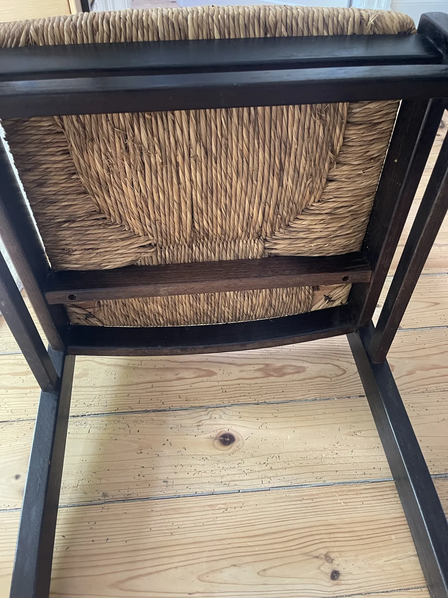 Pair of straw-seated wooden chairs in the regain style.