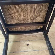 Pair of straw-seated wooden chairs in the regain style.